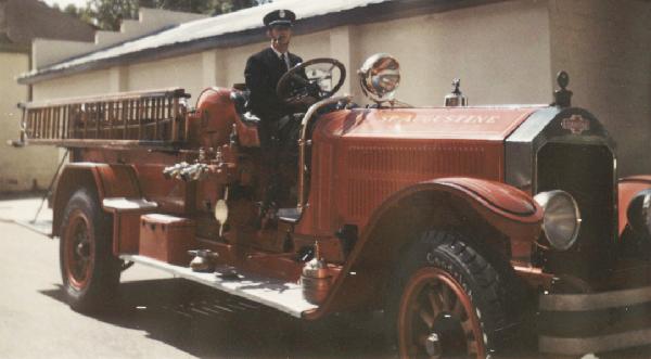 Old Fire Engine with Fire Fighter driving